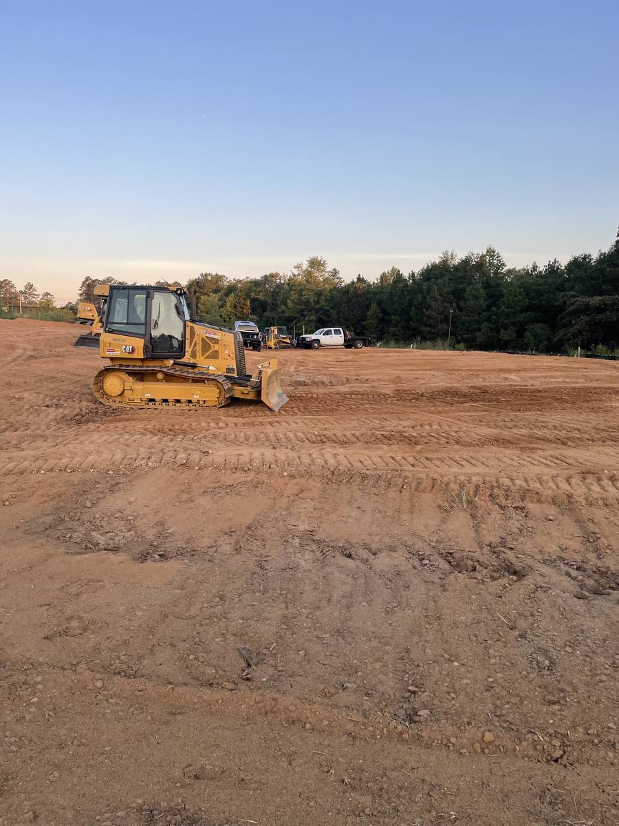 Dozer working a large graded pad